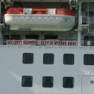 Sign on the side of the ship warning people to keep away
