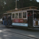 A cable car stopped at the top of Lombard Street