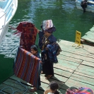 Woman and child selling textiles