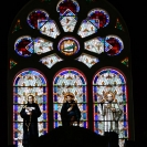 Stained glass window behind the altar