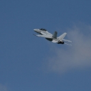 An F/A-18 doing a high alpha pass over the Detroit River