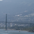 A floatplane taking off towards the Lions Gate Bridge