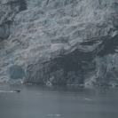 A small boat passing in front of Wellesley Glacier