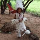 A kid in a feathered costume