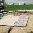 Laying the bricks for the patio