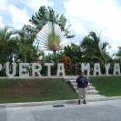 Cathy in front of the Puerta Maya sign