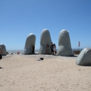 Statue of a hand sticking out of sand in Punta del Este