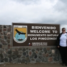 Cathy at the sign for Monumento Natural Los Pinguinos