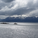 Les Eclaireurs Lighthouse against a background of the Beagle Channel and the mountains